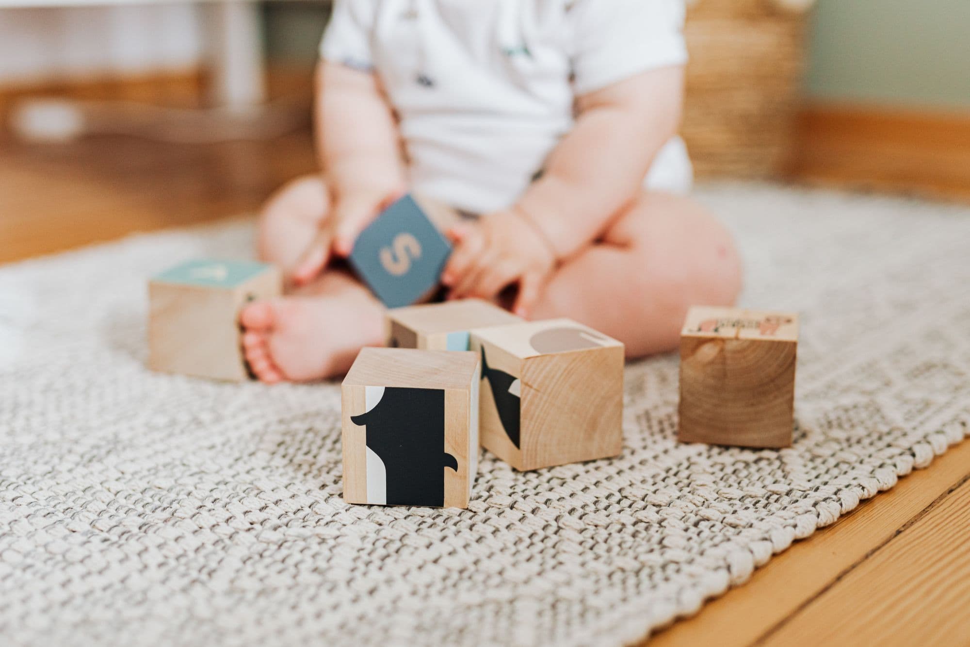 Child playing with building blocks, representing child development